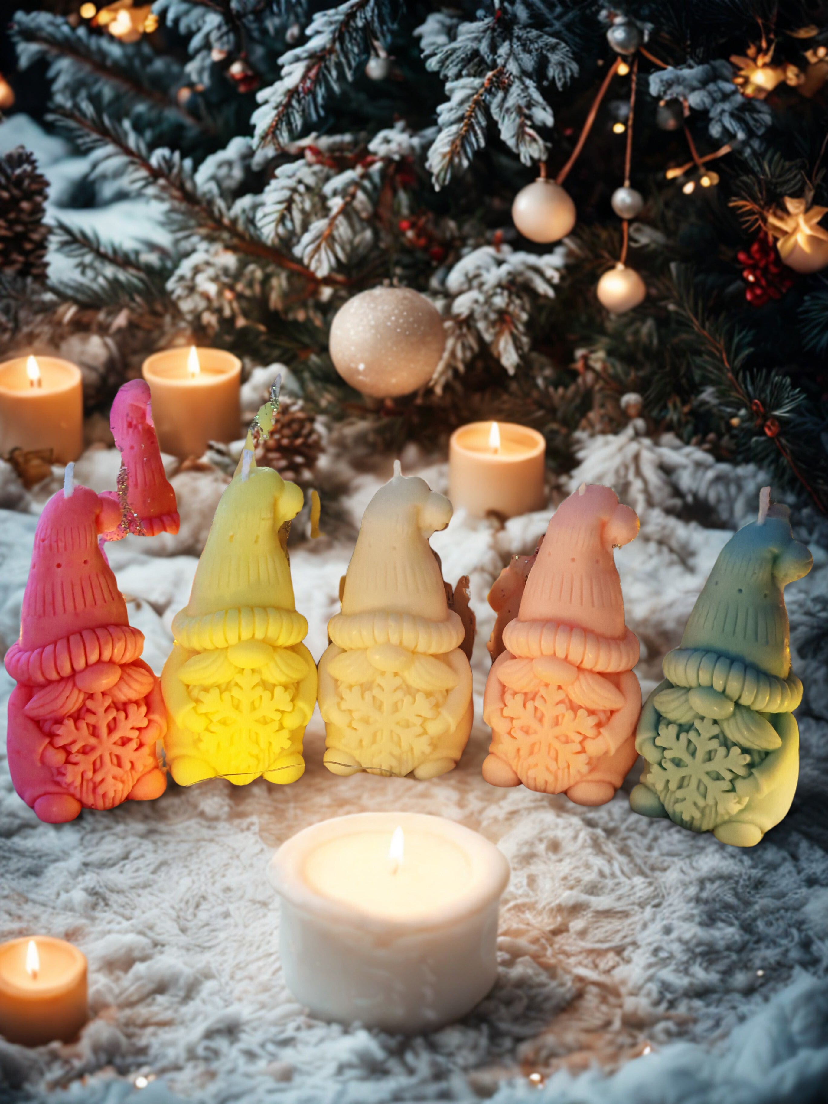Colorful gnome-shaped candles in front of a decorated Christmas tree.